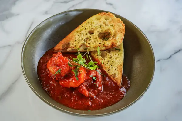 Garlic prawns in napolitana sauce with garlic bread