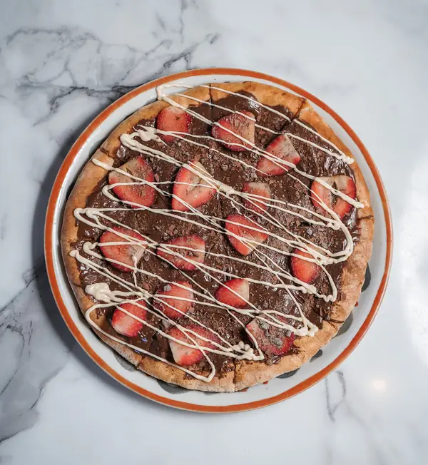 Open Nutella pizza with strawberries