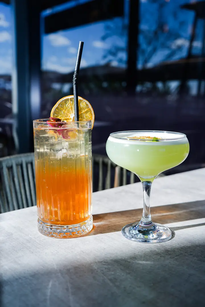 Two cocktails by the window