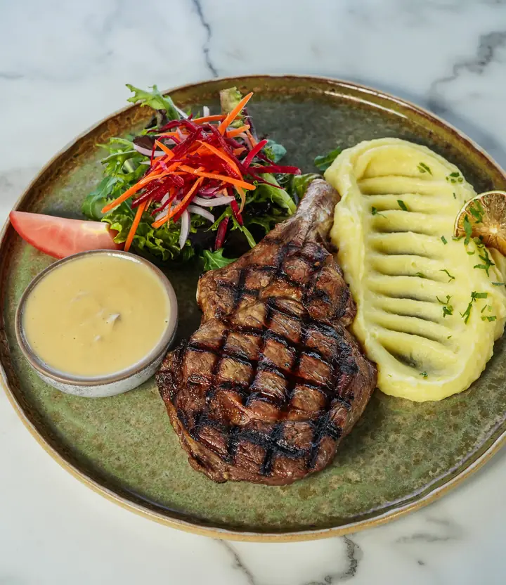 Steak with sauce and a side